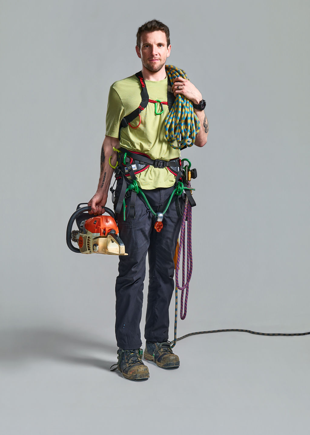 Brent Hocking, ISA Board Certified Master Arborist, in climbing harness with rope